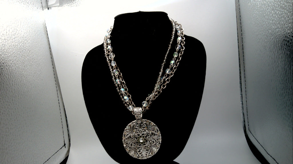 Vintage Avon Nancy and Rise Triple Strand Necklace with Silver tone Filigree Medallion along with Rhinestones.
