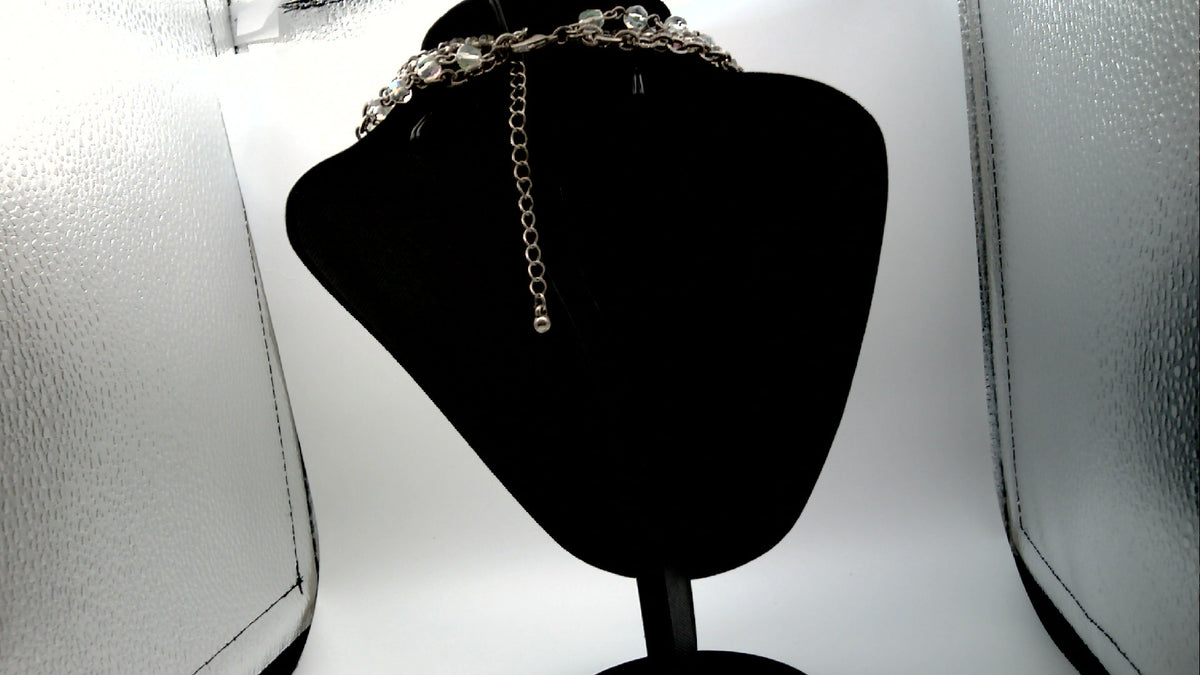 Vintage Avon Nancy and Rise Triple Strand Necklace with Silver tone Filigree Medallion along with Rhinestones.